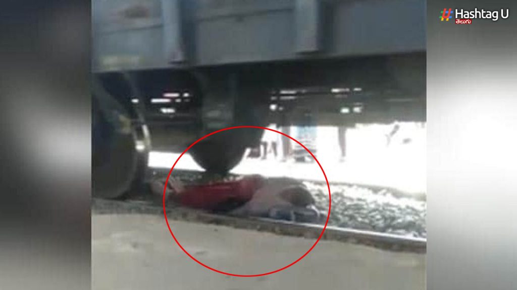 The train moved while crossing the tracks.. The woman missed the accident