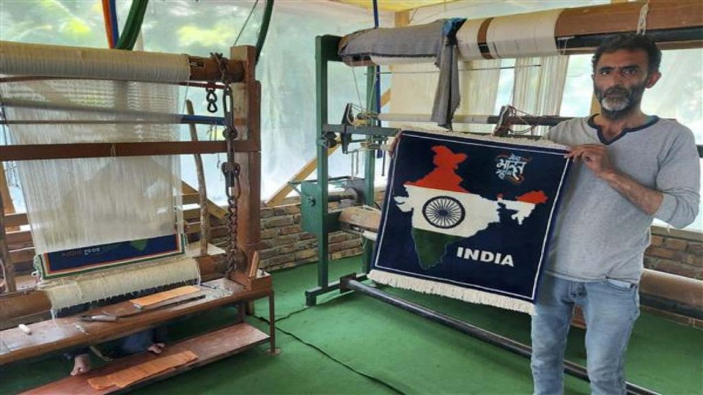 Kashmiri artisan weaves carpet with map of India in tricolour