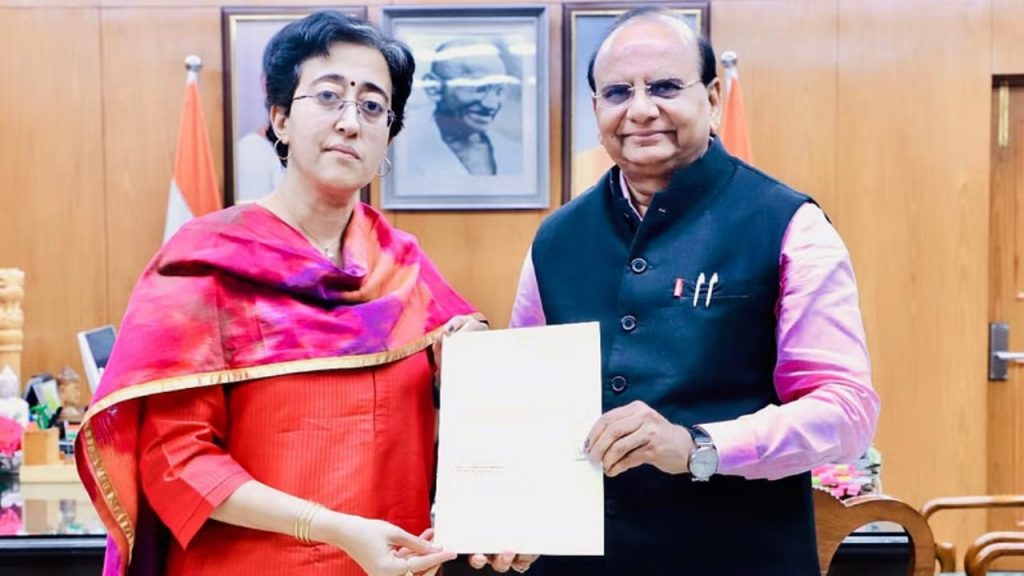 V K Saxena, Atishi